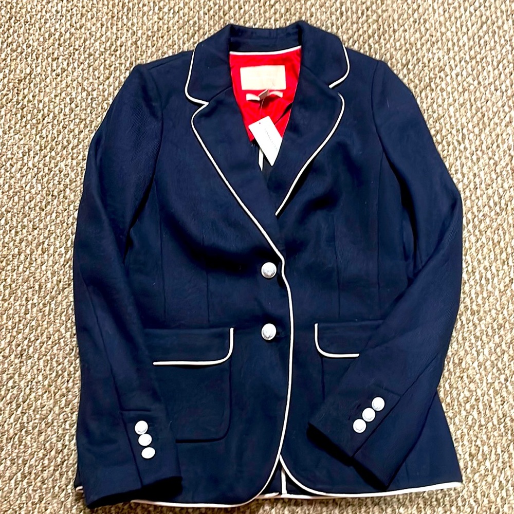 Brand new Banana Republic navy blazer w/white trim. Wool nylon blend w/pockets